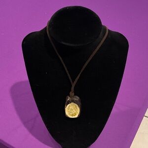 Gold Pendant on Brown Cord Necklace